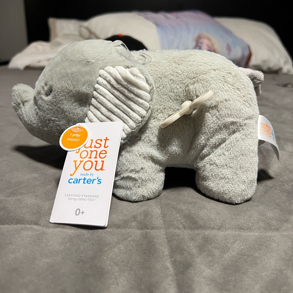Carters Just One You. Stuffed elephant that plays music when wound up